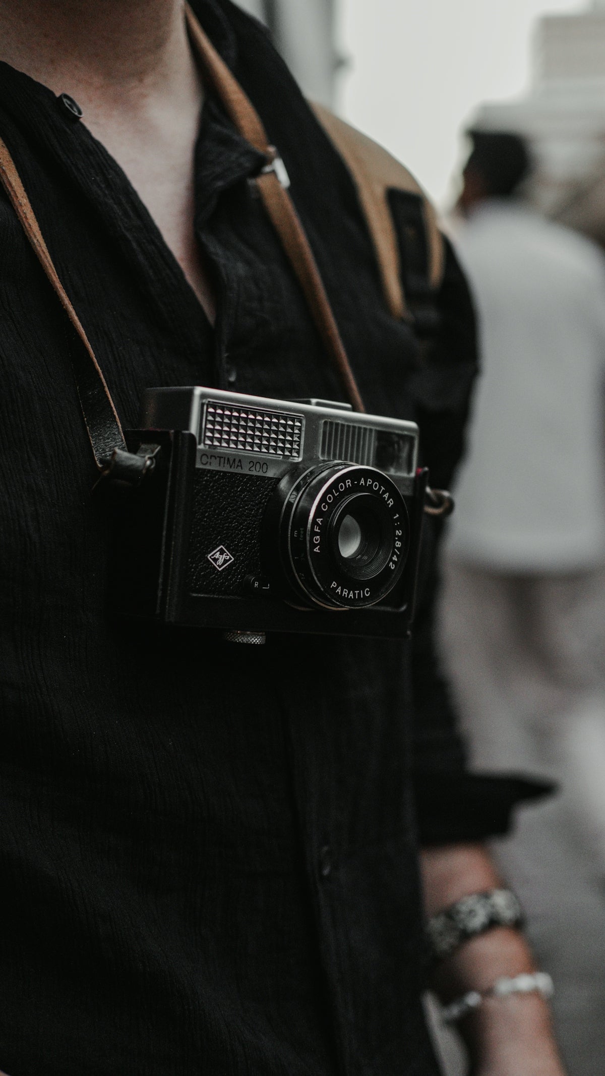 A man is holding a camera in his hand