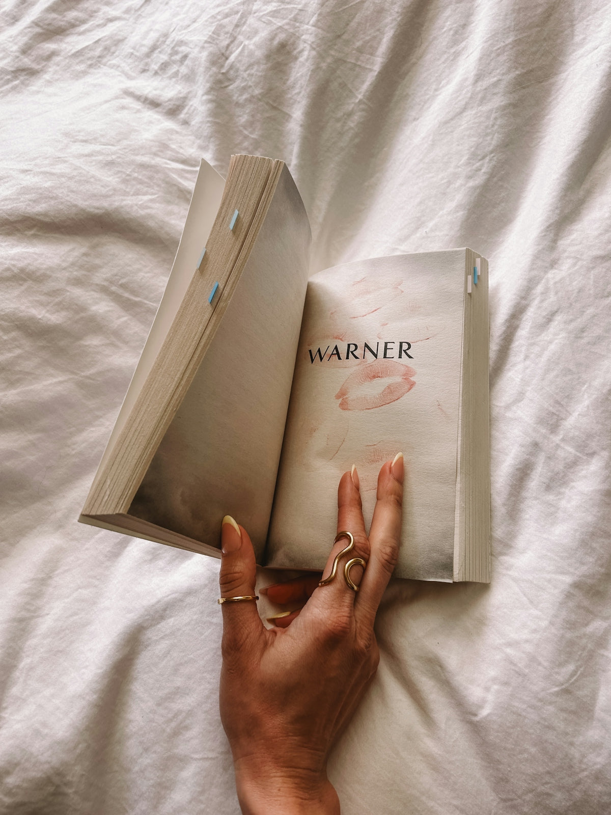 A book is open with lipstick marks.