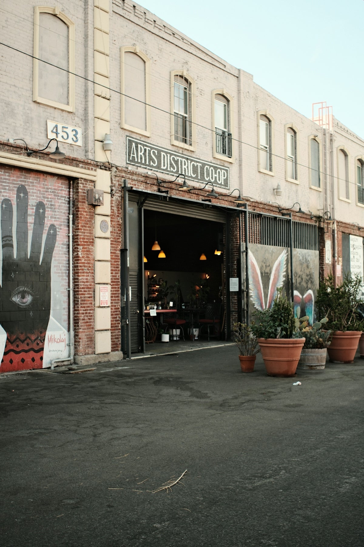 Arts district co-op building with mural and mural